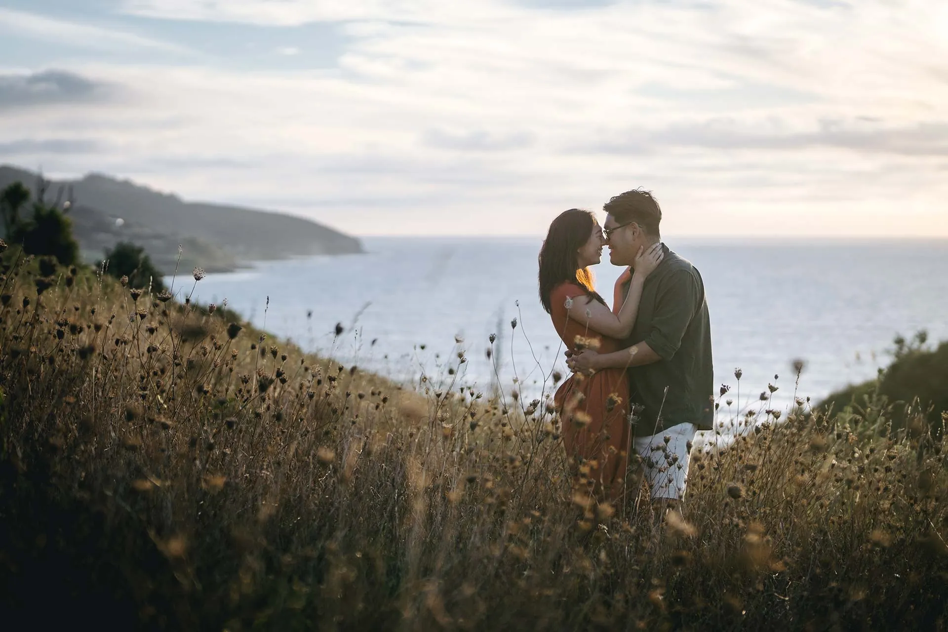 Raglan clifftop engagement couple