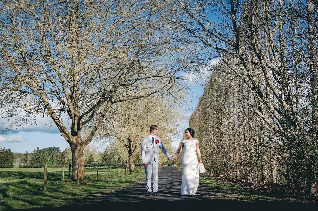 Boatshed Karapiro tree lined wedding portrait