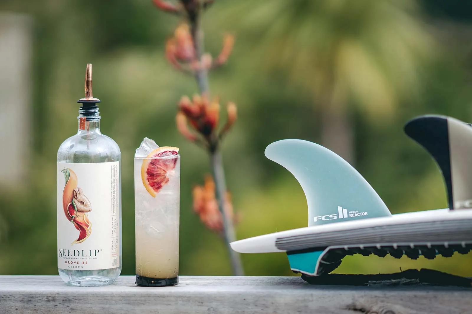 Beverage and surf products photographed outdoors