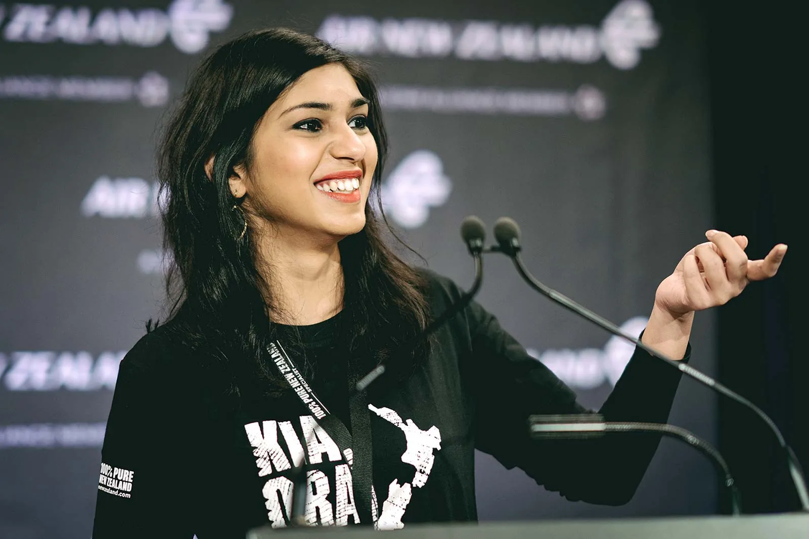 Conference speaker presenting on stage