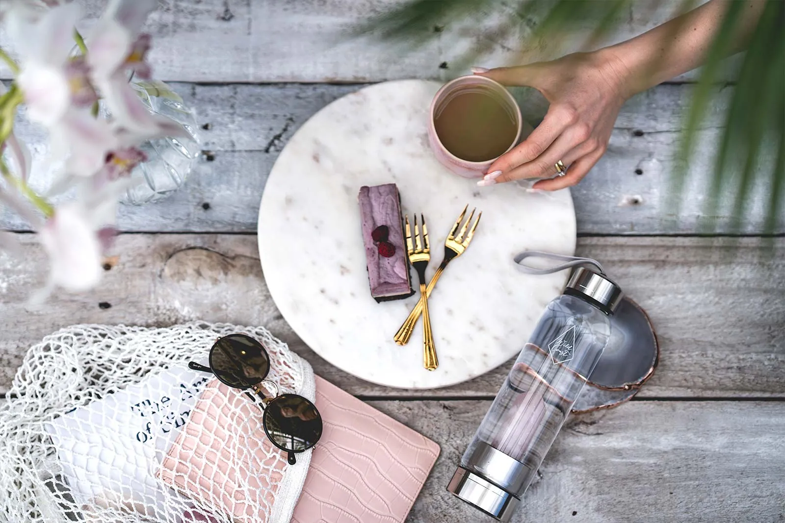 Lifestyle products arranged in a styled flat lay