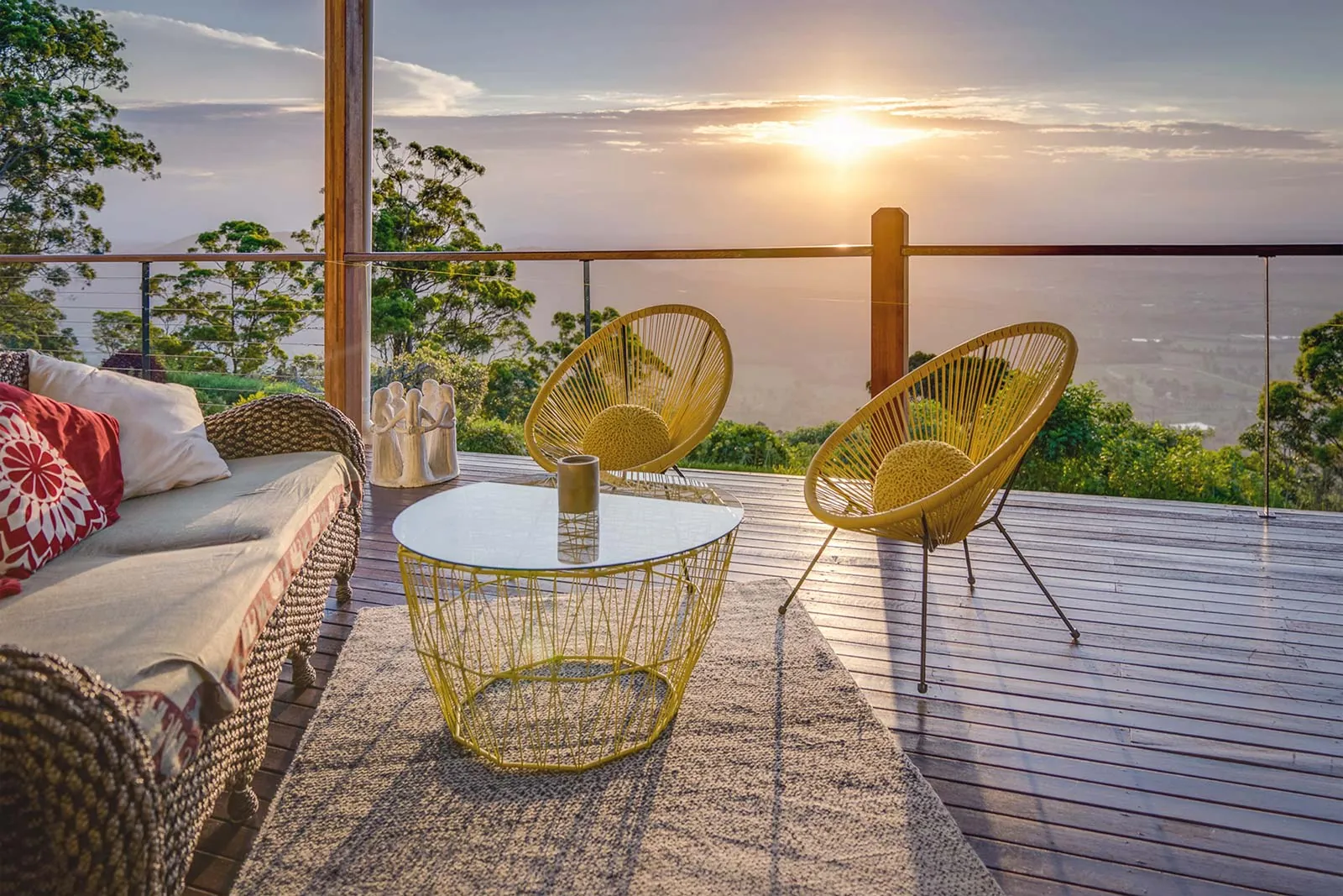 Luxury property deck photographed at sunset