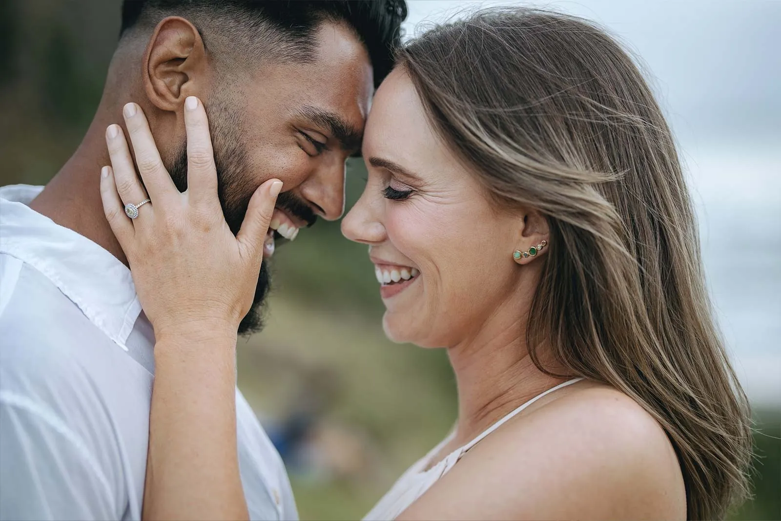 Smiling engaged couple in a close-up portrait