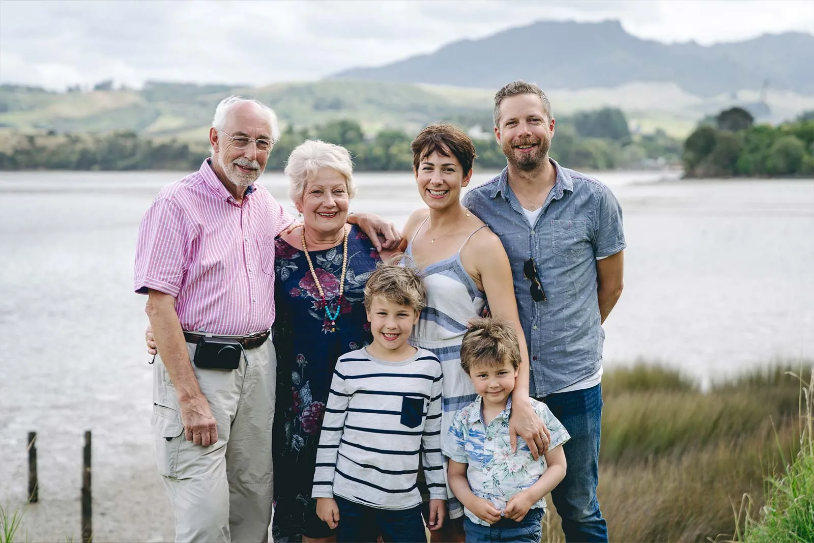 Multigenerational family portrait beside a Waikato lake
