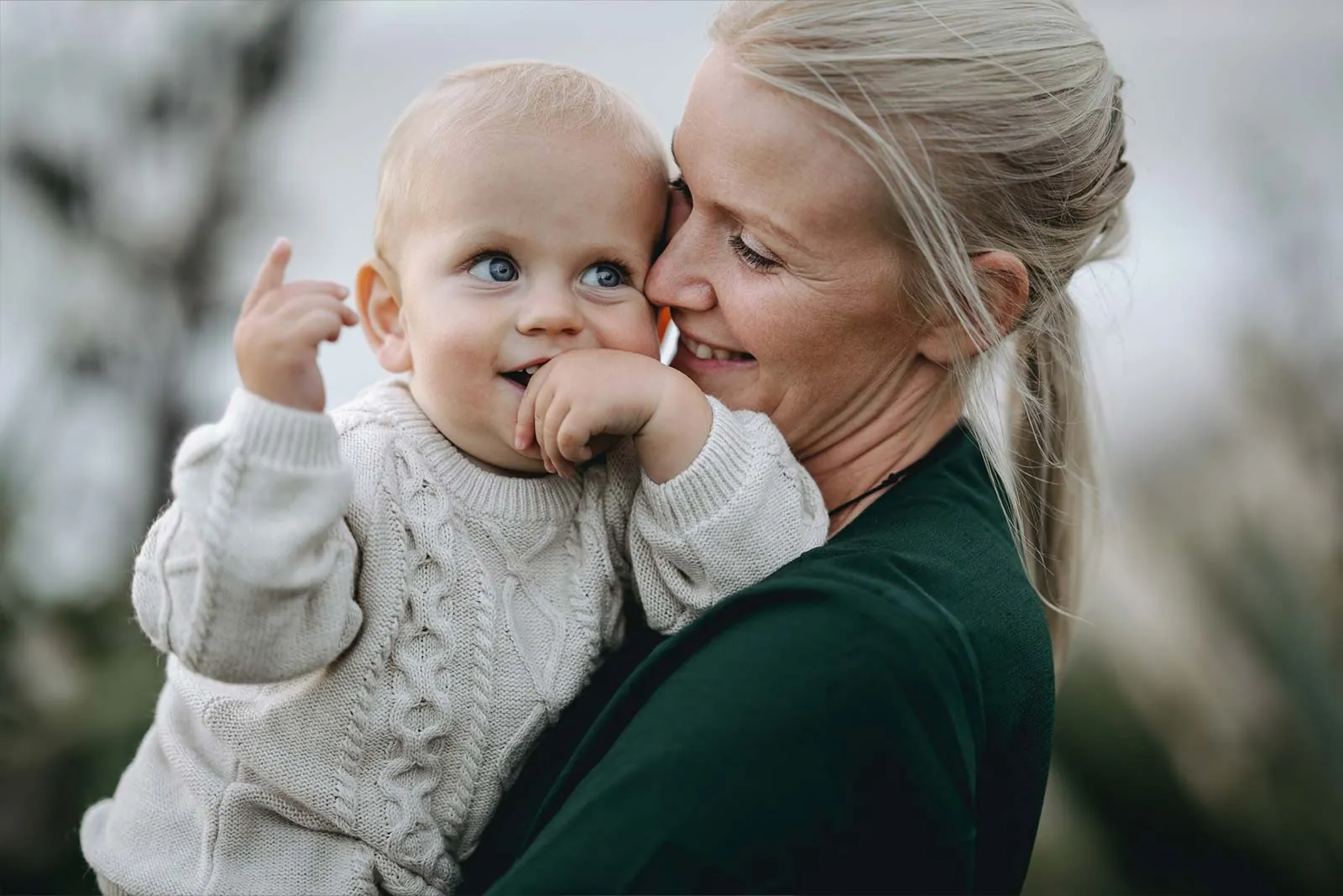 Mother holding her smiling baby