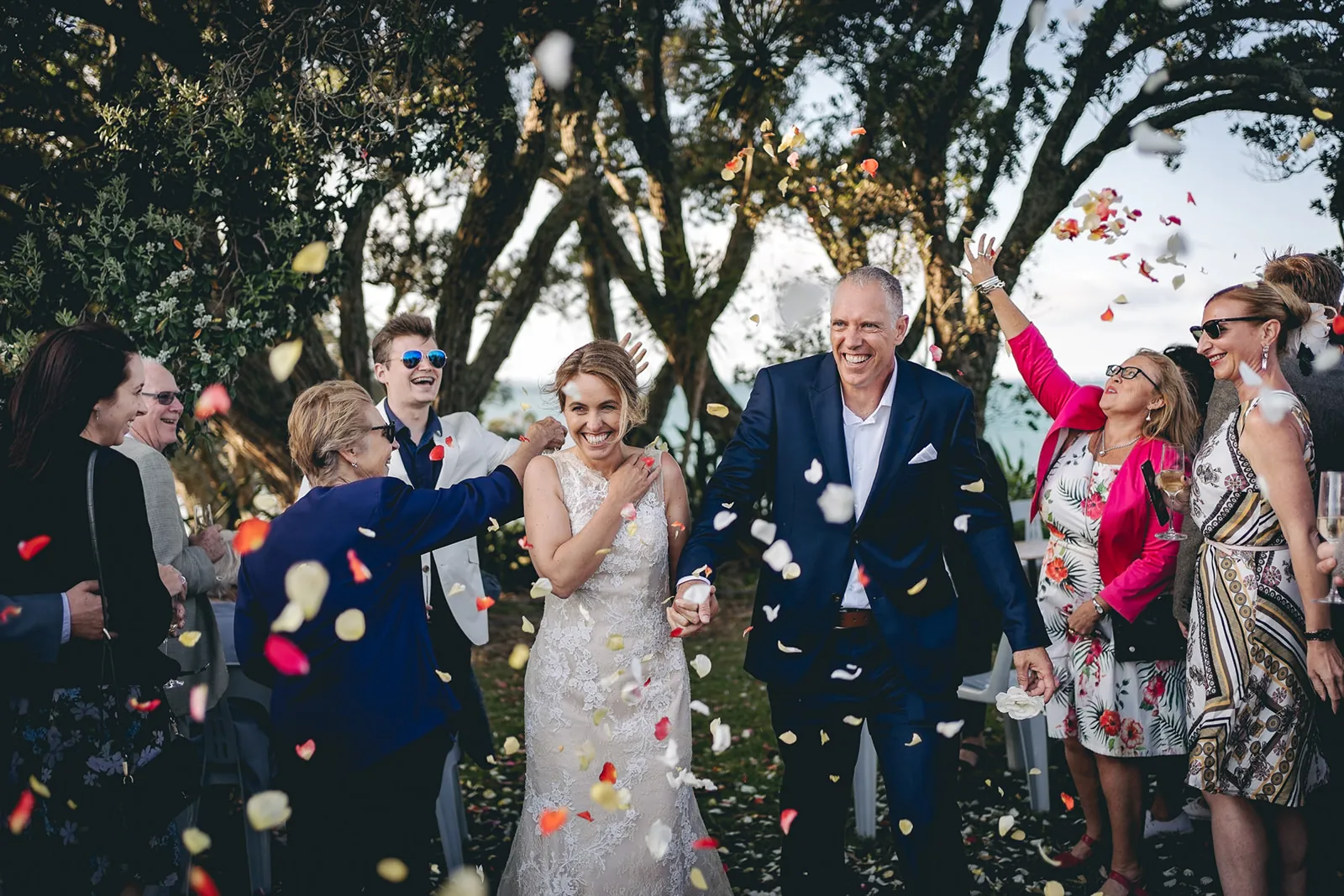 Newlyweds celebrating amid colourful confetti